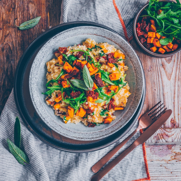 Sweet potato risotto with arugula and dried tomatoes