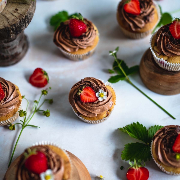 Berry cupcakes with chocolate frosting
