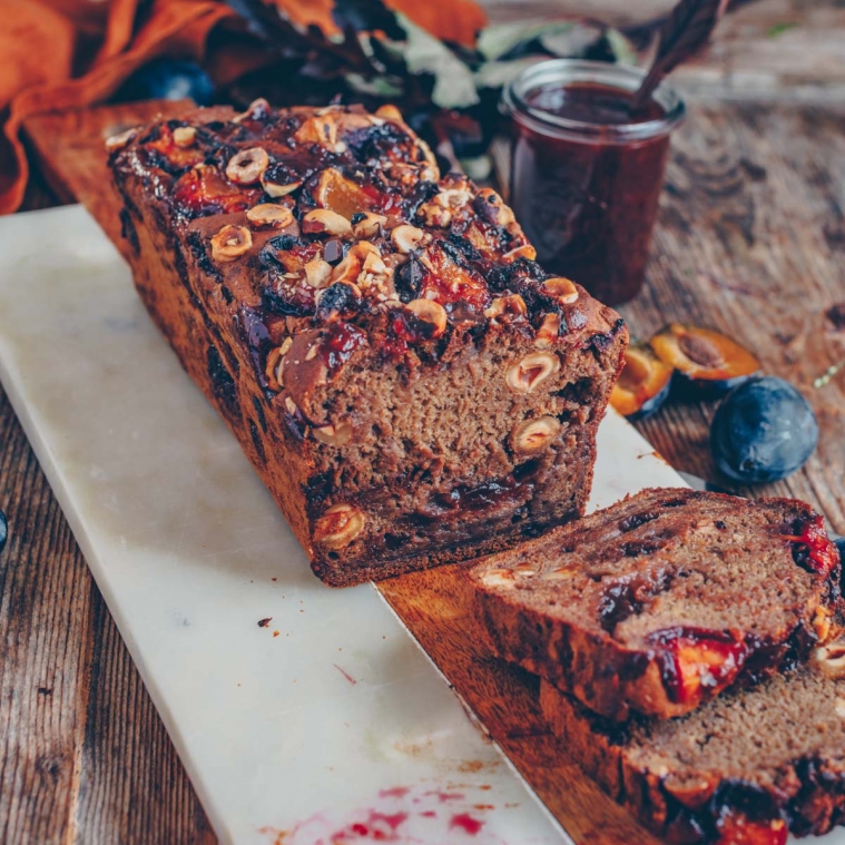 Banana bread with plums and hazelnuts